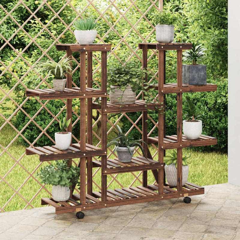 Load image into Gallery viewer, Vidaxl plantenstandaard met wielen 110x25x115 cm massief vurenhout