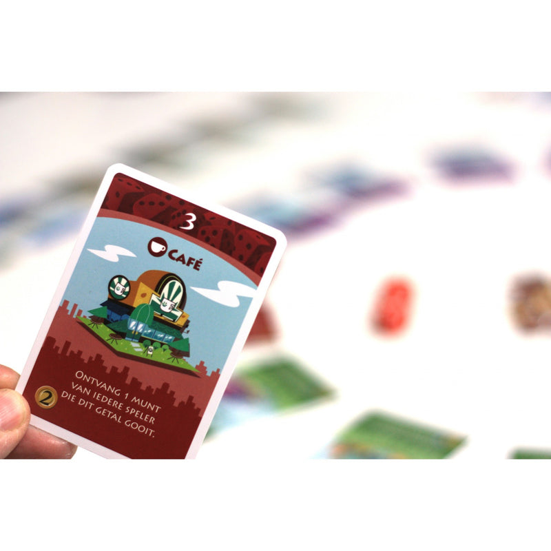 Load image into Gallery viewer, White goblin games machi koro dobbelspel (nederlands, 2 - 5 spelers, 40 minuten, vanaf 7 jaar)