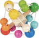 Goki baby bijtring: ellipsoid regenboog diam.9,5cm, met elastiek, hout, in vensterdoos