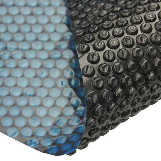 Vidaxl zwembadfolie solar drijvend 600x300 cm pe zwart en blauw