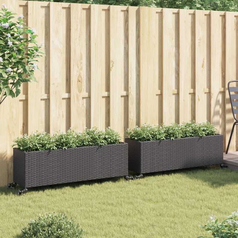 Load image into Gallery viewer, Vidaxl plantenbakken met wielen 2 st 107x32x38 cm poly rattan zwart
