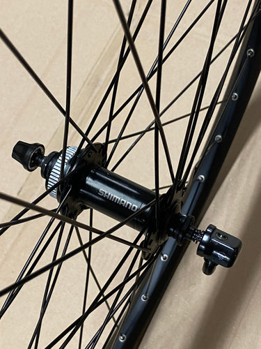Roland voorwiel 27 21-584 taurus alu. zwart shimano tx505 schijfrem