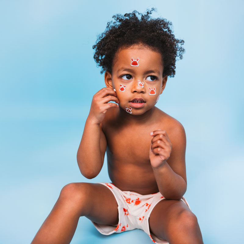 Load image into Gallery viewer, Crabby | beige rode uv zwemboxer jongens
